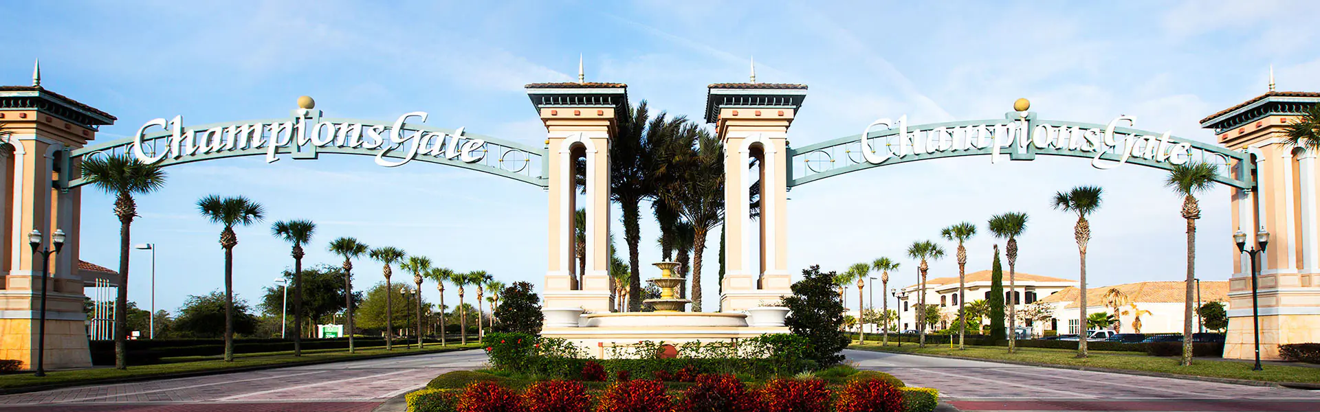 The gated entrance to the ChampionsGate resort community in Davenport, Florida, with palm-lined roads