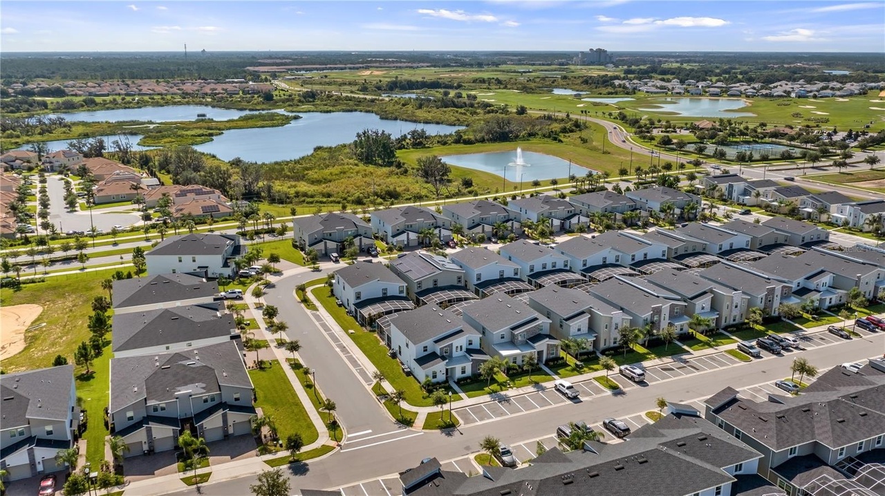 An aerial view over the ChampionsGate resort community in Davenport, Florida, with villas, lakes and palm trees